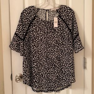 Black and white floral print blouse with t-shirt feel. New never worn. Tags on.